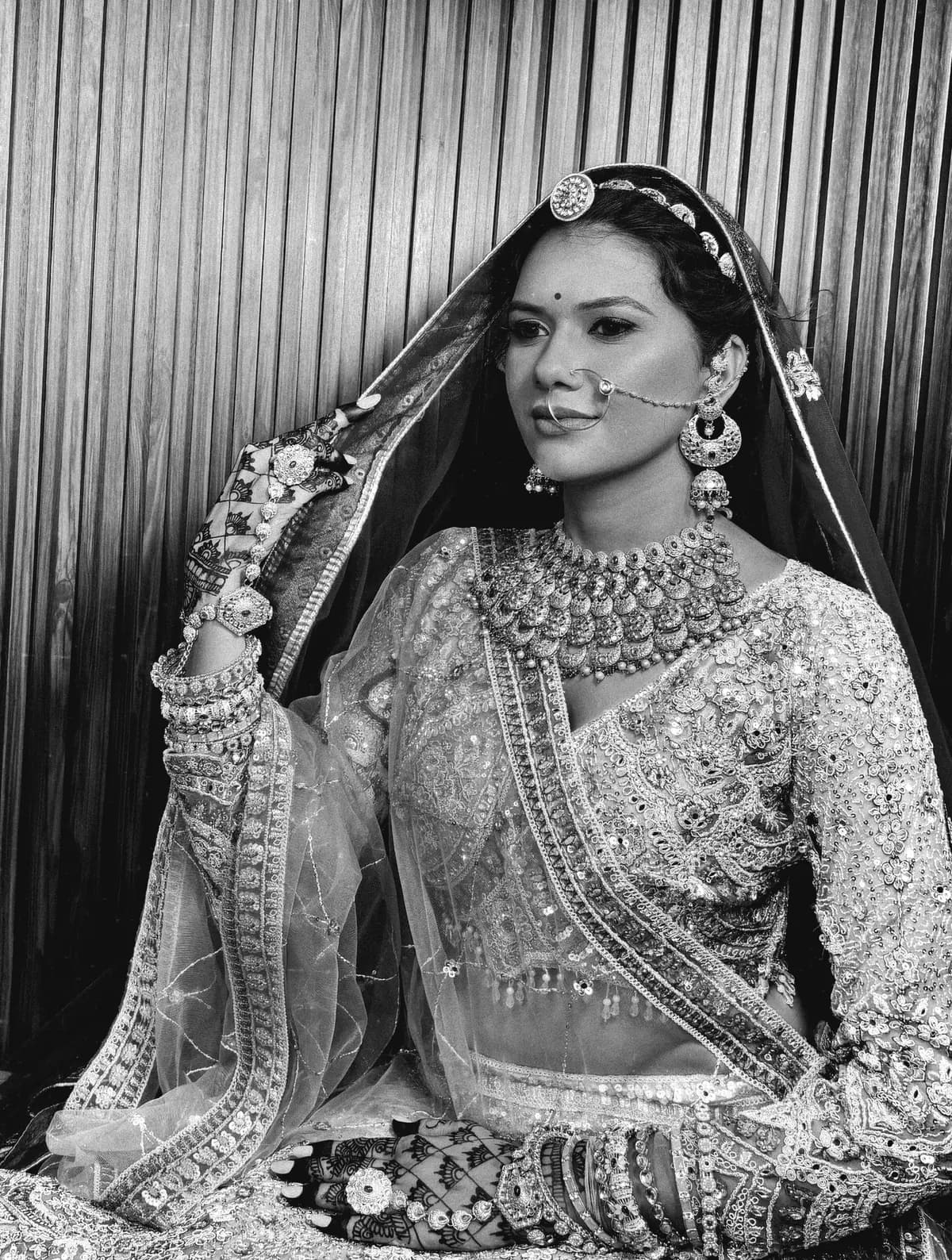 Black and white bridal portrait with nath and layered necklaces