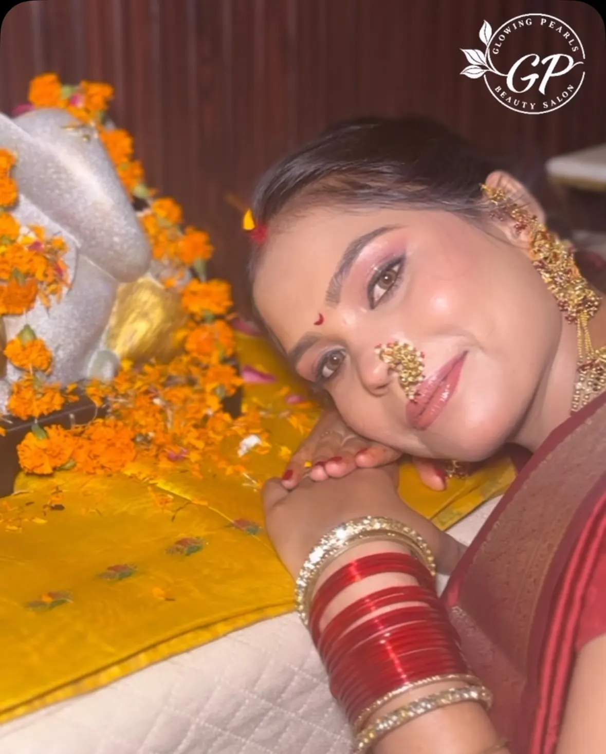 Festive look with marigolds, nath and red chooda for Ganesh Chaturthi