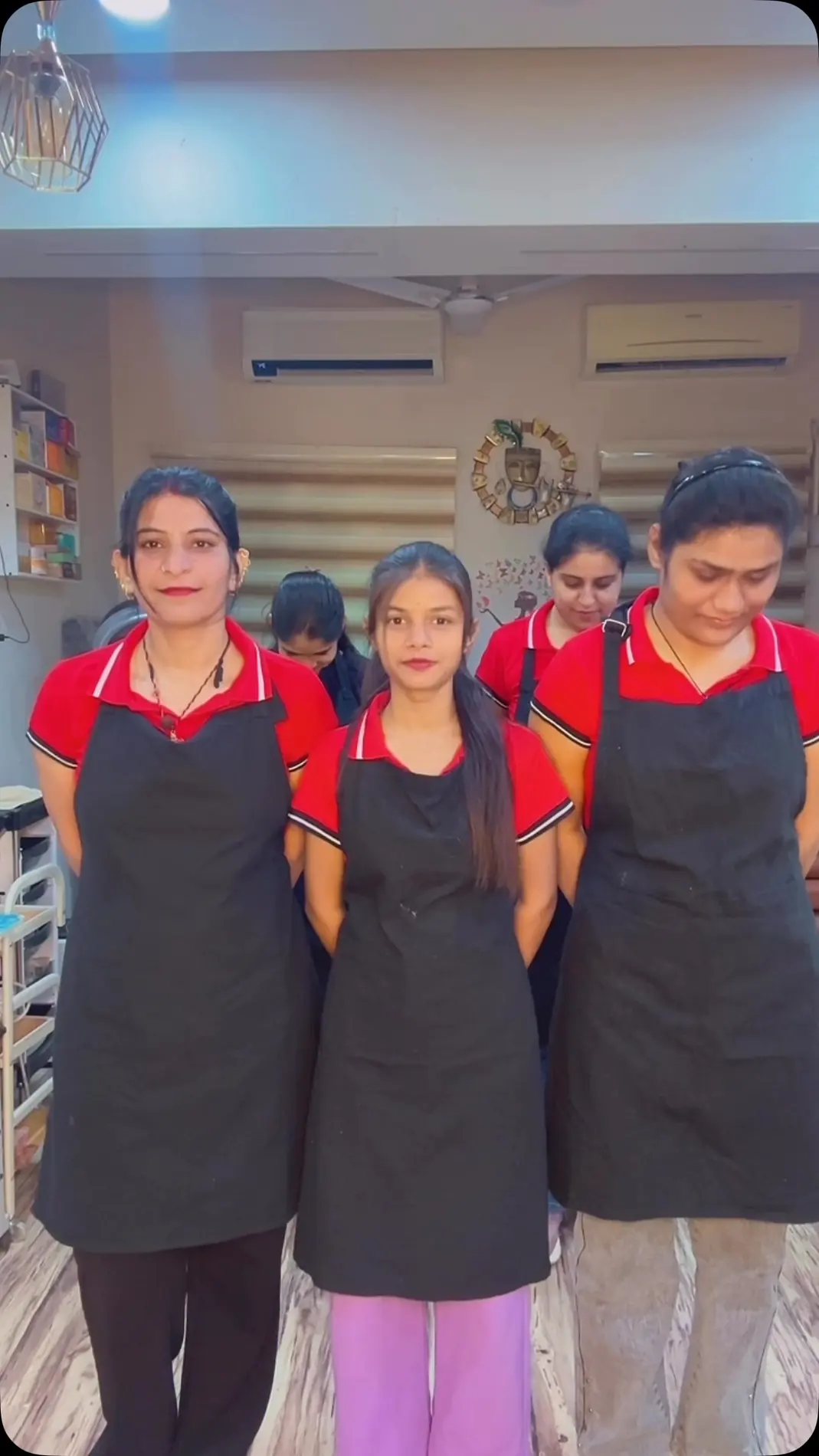 The Glowing Pearls team in uniform inside the salon